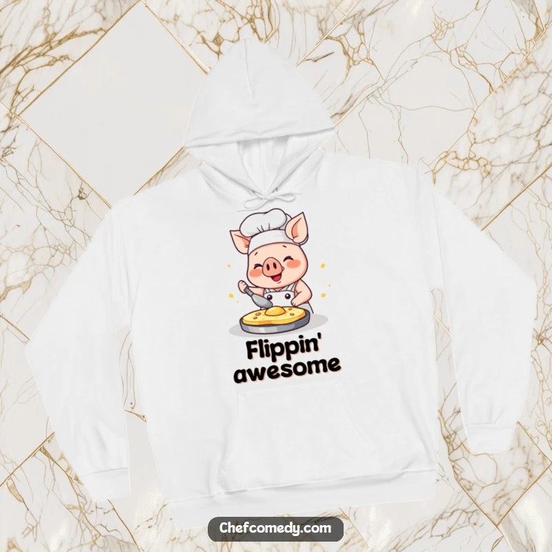Funny kawaii pig chef hoodie, a happy pig focused on flipping a pancake with glee, cozy kitchen attire.