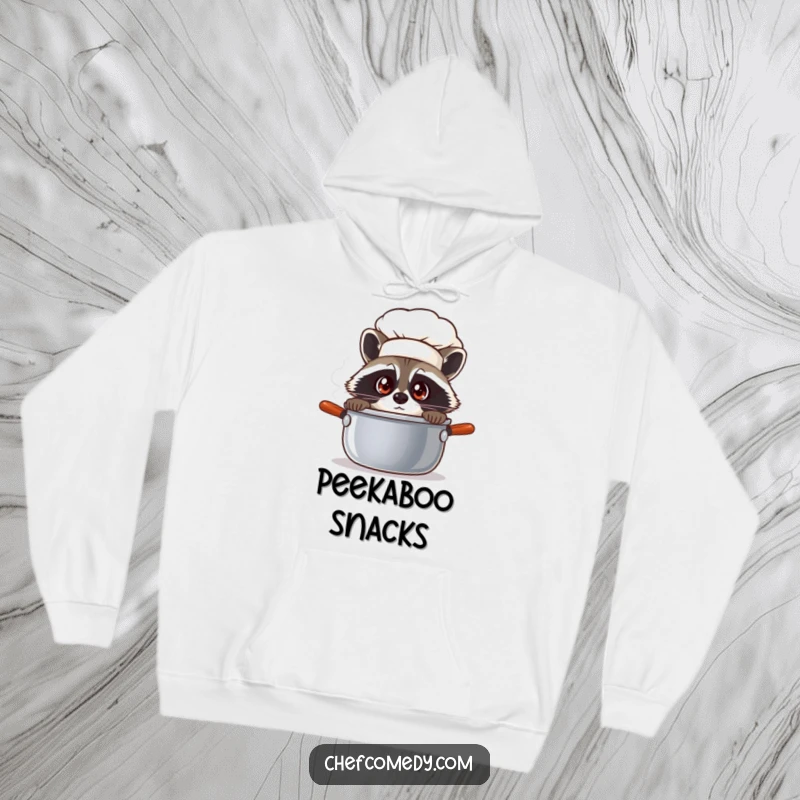 Funny raccoon chef peeking into a steaming pot, featured on a cozy hoodie, perfect for staying warm and curious.