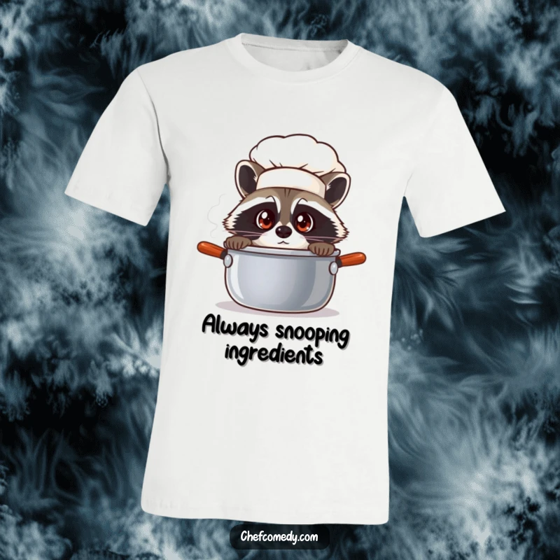 Funny raccoon chef with wide eyes peeking into a steaming pot, printed on a comfortable t-shirt for curious souls.