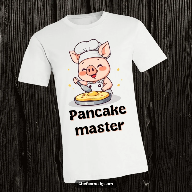 Funny kawaii pig chef t-shirt, a happy pig concentrating on flipping a pancake with immense glee, culinary fun.